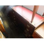 A mahogany pedestal desk with red leather insert