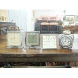 Four small mantle clocks