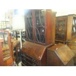 A mahogany bureau bookcase