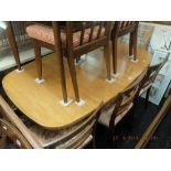 A Teak retro extending dining table with two leaves