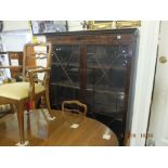 A mahogany glazed bookcase