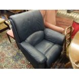 A blue leather reclining arm chair