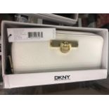 A DKNY white purse, leather, brand new unused, still has labels etc.