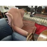 A pink upholstered library chair