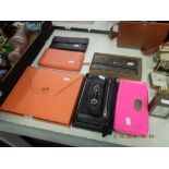 Six designer purses and a Hermes note pad