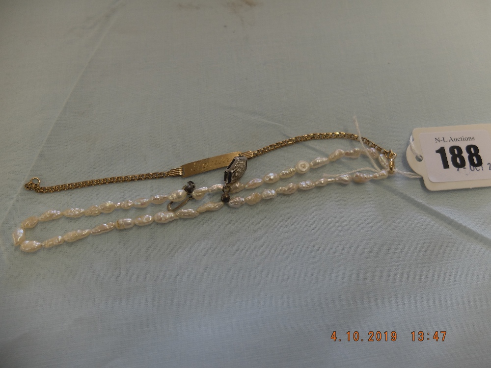 A silver and pearl bracelet and a 9ct gold name tag bracelet