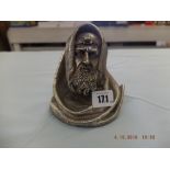 A white metal bust of a rabbi "N Bar Oh"