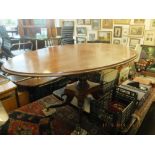 A Regency mahogany oval tilt top table on splayed base