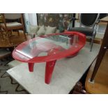 A red retro style coffee table with red edged glass