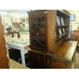 A mahogany bookcase on cupboard base