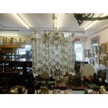 A 1970's brass and crystal Orrefors chandelier designed by Carl Fagerlund height of light