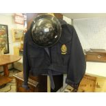 A civil defence corps uniform and helmet