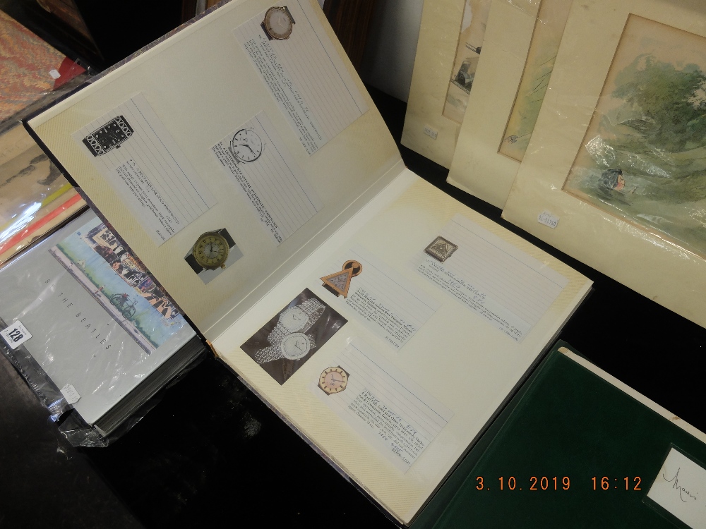 A vintage scrap book of watches from previous auctions