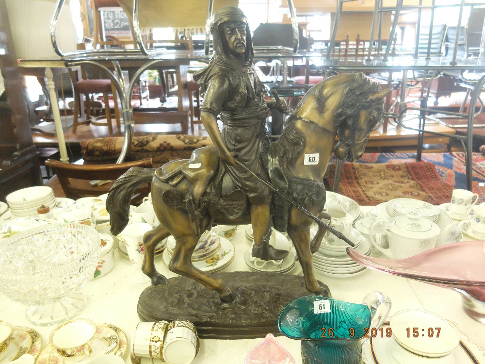 A bronze sculpture of Bedouin on horseback