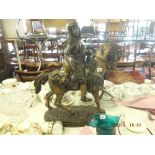 A bronze sculpture of Bedouin on horseback