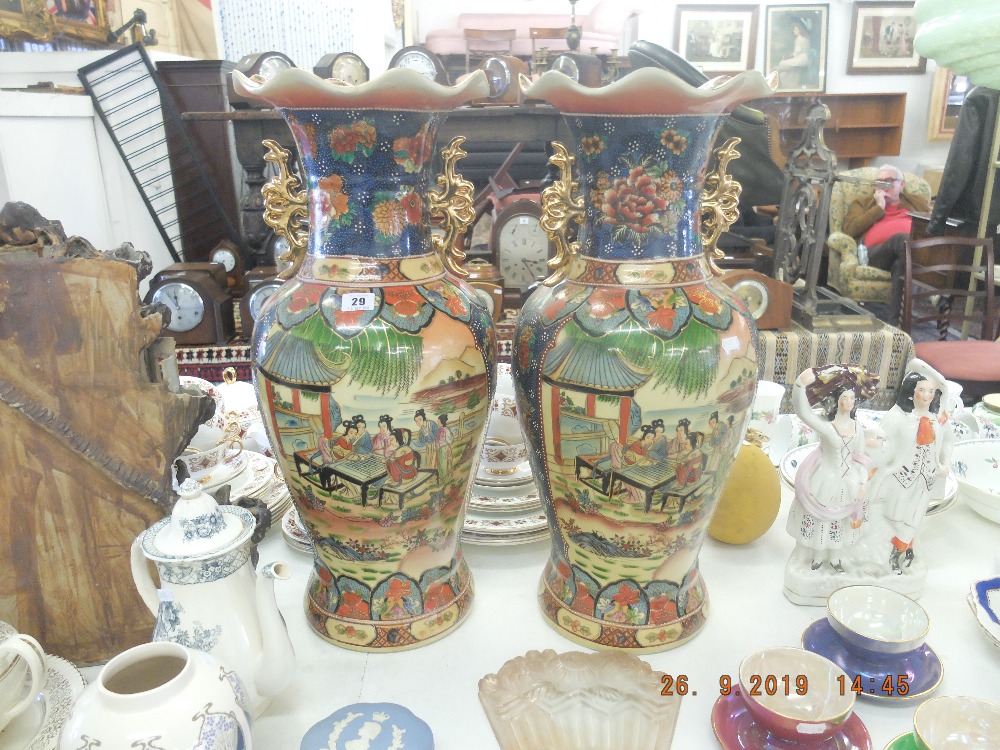 A pair of Chinese temple vases,