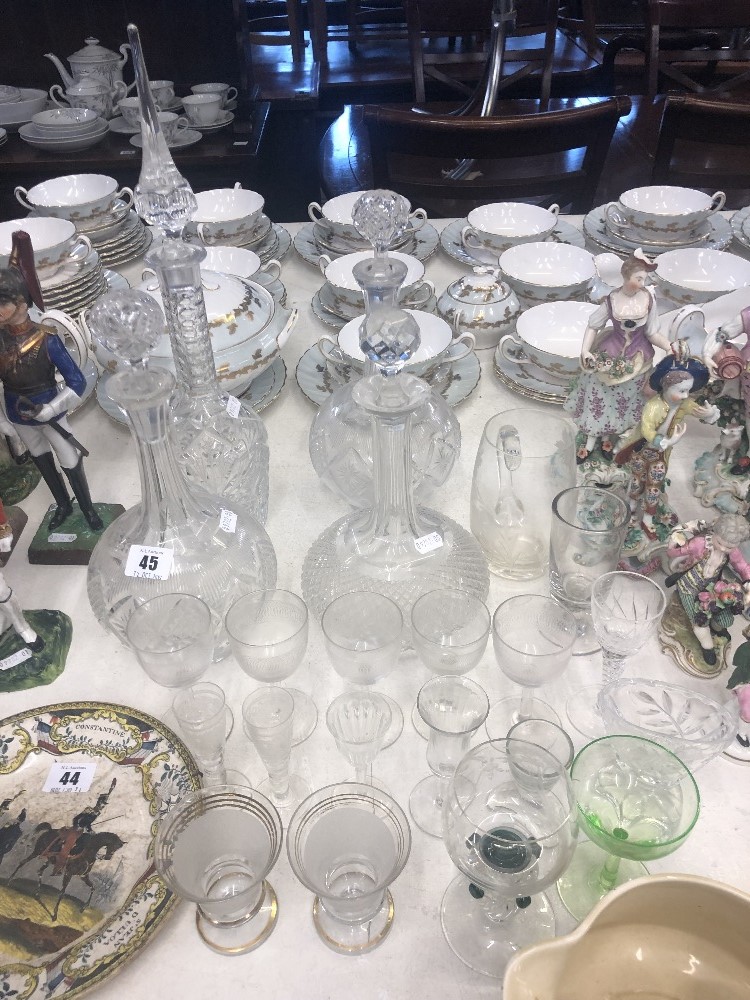 A quantity of assorted glassware including four decanters