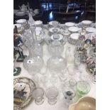 A quantity of assorted glassware including four decanters
