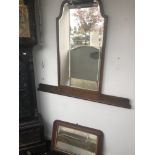 A walnut over mantle mirror and another