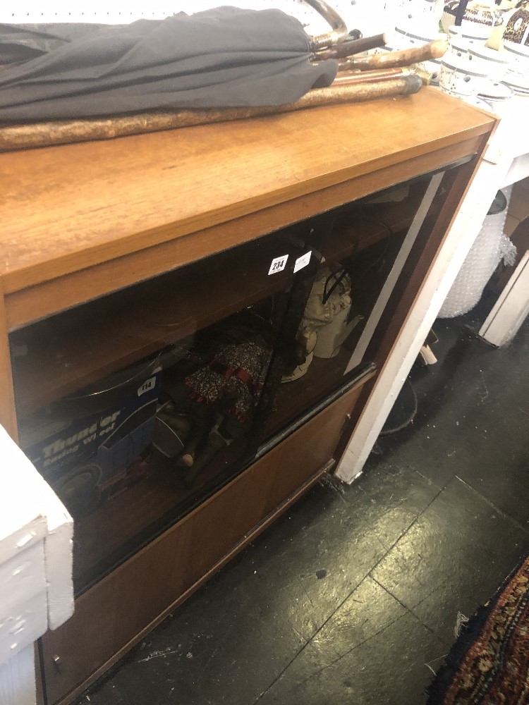 A SMOKED GLASS CABINET