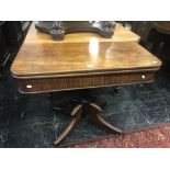 A 19th century fold over mahogany tea table