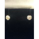 A pair of 9ct gold and diamond stud earrings