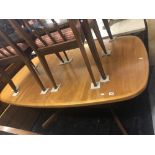 A Teak retro extending dining table with two leaves