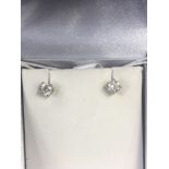 A pair of 18ct yellow gold and diamond stud earrings, total approximately 0.
