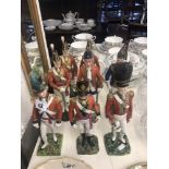 A collection of eight Dresden plus one Sevres porcelain figures of solders,