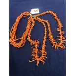 Two stick coral necklets and six strand coral bead necklace