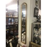 A pair of gilt framed mirrors