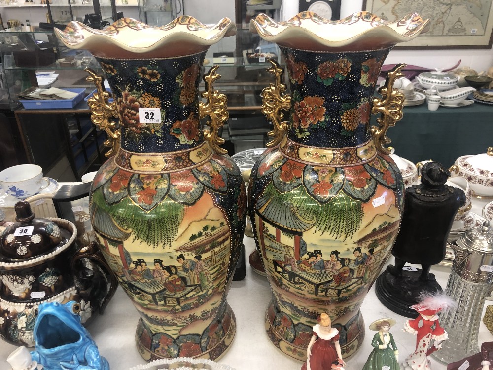 A pair of Chinese temple vases,
