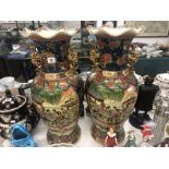 A pair of Chinese temple vases,