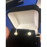 A pair of 18ct gold diamond stud earrings 0.