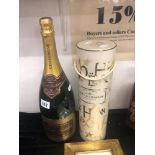 A Magnum bottle of champagne and a bottle of Moet