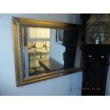 A gilt framed mirror