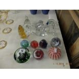 A quantity of glass paperweights including Wedgewood