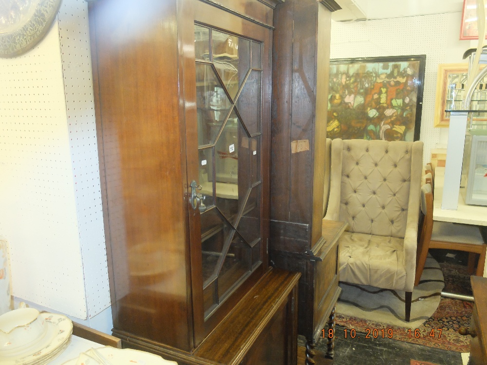 A mahogany bookcase on cupboard base