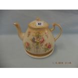 A late Victorian Crown Devon teapot and stand