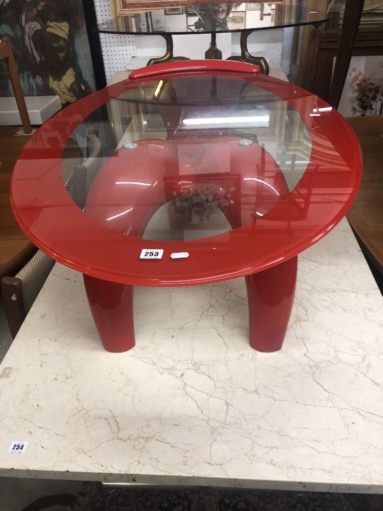 A red retro style coffee table with red edged glass