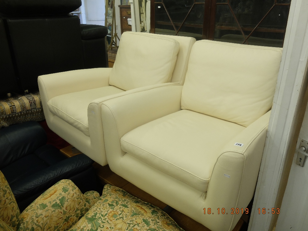 A pair of leather swivel armchairs