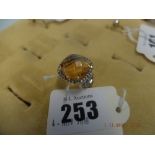 An 18ct white gold citrine ring with diamond halo and shoulders size N