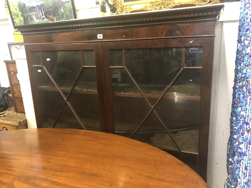 A mahogany glazed bookcase