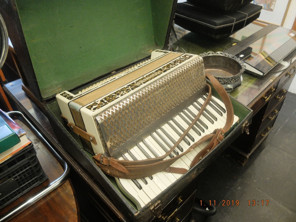 A Hohner Verde accordion in original case A/F