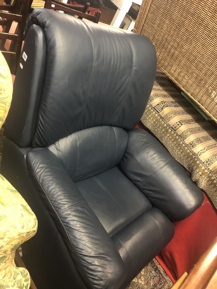 A blue leather reclining arm chair