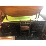 A large mahogany leather top desk