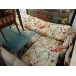 A floral upholstered four seater sofa