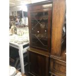 A mahogany bookcase on cupboard base