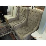 A pair of wing armchairs
