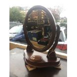 A mahogany swing toilet mirror